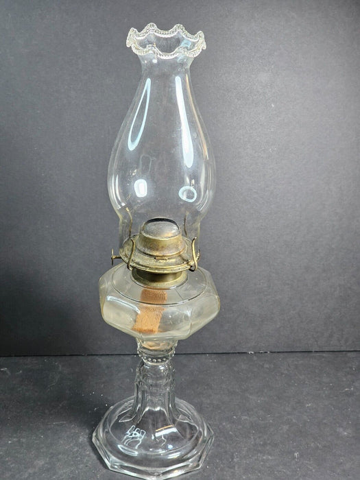 Kerosene lamp 1890s excellent condition with decorative globe,17 " tall clear .