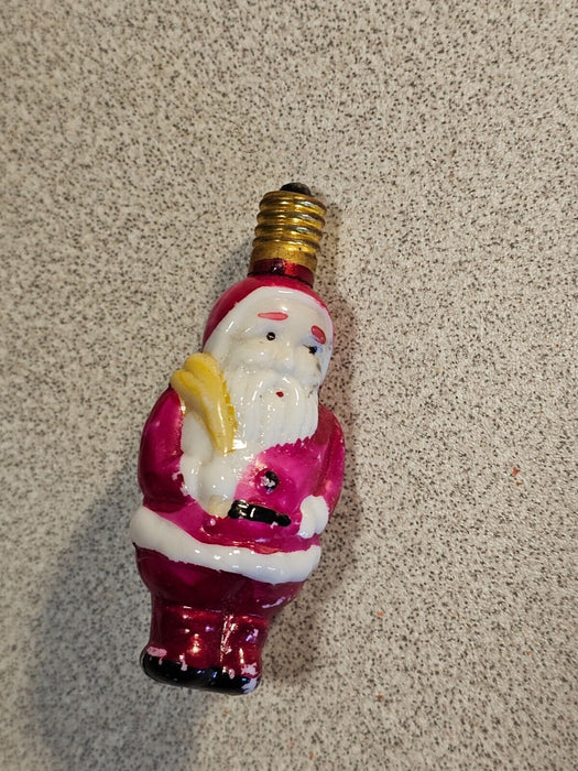 Pair of 2 " figural santa light bulbs not tested.