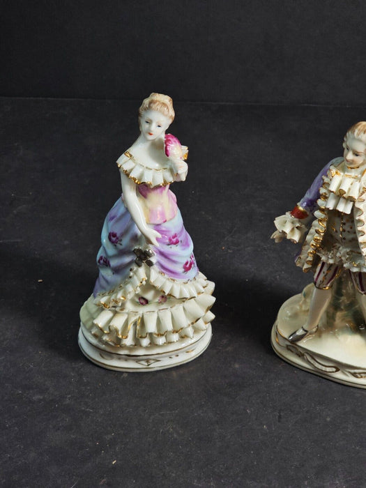 Pair of 6" figurines Man and woman Crossed swords on the man's base., Antiques, David's Antiques and Oddities