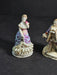 Pair of 6" figurines Man and woman Crossed swords on the man's base., Antiques, David's Antiques and Oddities