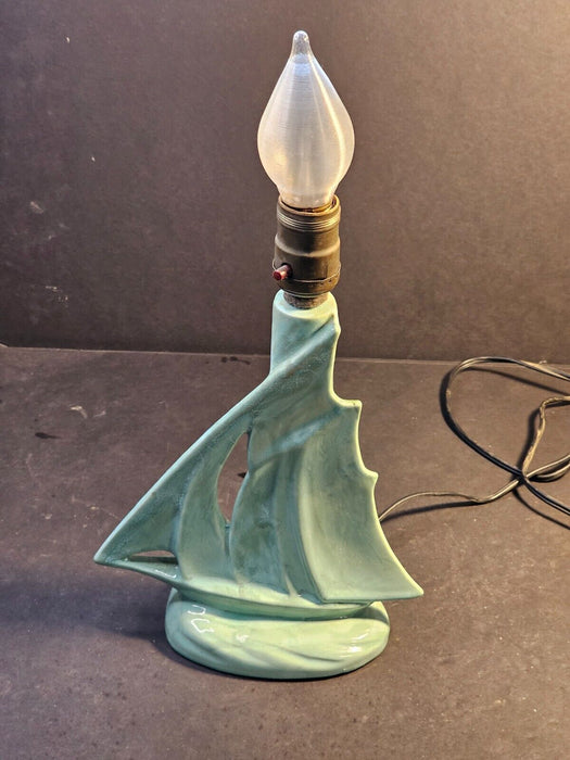 MCM green ceramic sailboat lamp. works but wire not through hole/9x12