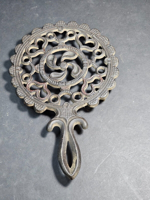 Round trivet cast iron black ornate design marked JHZ, Antiques, David's Antiques and Oddities