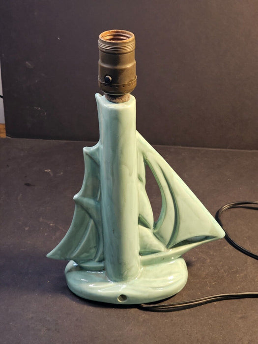 MCM green ceramic sailboat lamp. works but wire not through hole/9x12