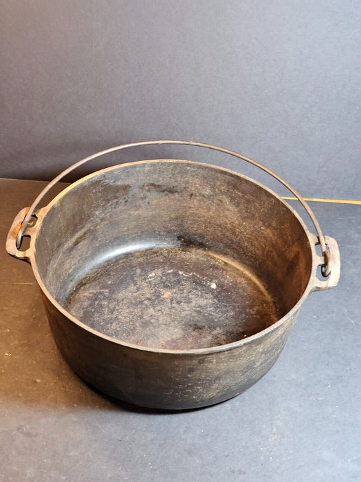 Griswold No. 9 covered pot.cast iron wire handle marked on bottom of pot/and lid