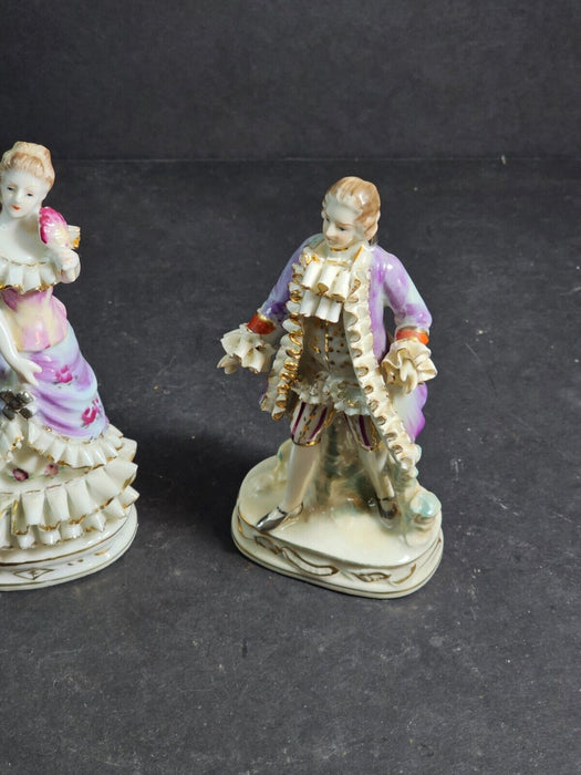 Pair of 6" figurines Man and woman Crossed swords on the man's base., Antiques, David's Antiques and Oddities