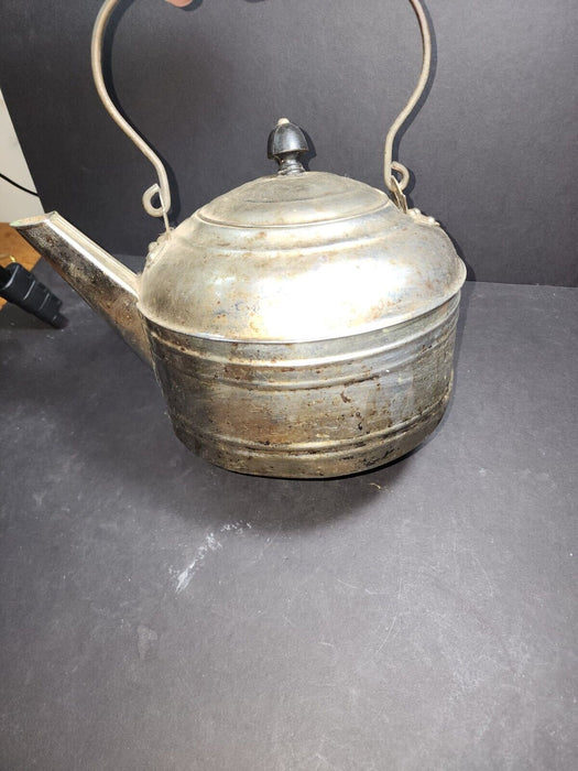 Nickel on copper kettle 7 " high x 10" wide.