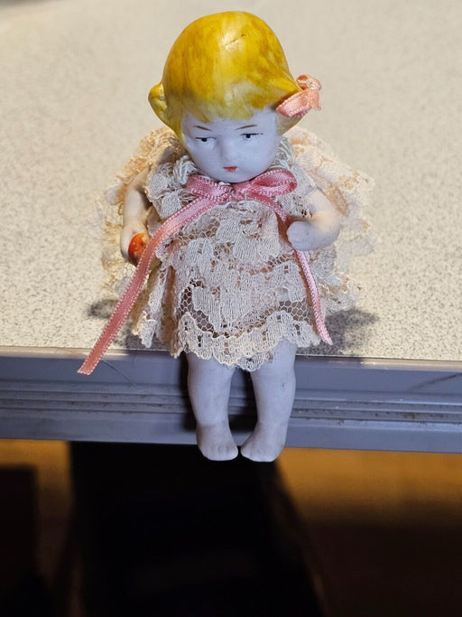 Seated solid german bisque doll . Aprox. 4" lace dress, blond hair., Antiques, David's Antiques and Oddities