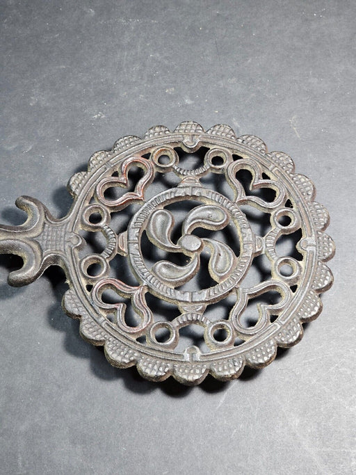 Round trivet cast iron black ornate design marked JHZ, Antiques, David's Antiques and Oddities