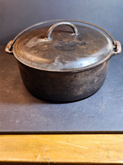 Griswold No. 9 covered pot.cast iron wire handle marked on bottom of pot/and lid