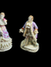 Pair of 6" figurines Man and woman Crossed swords on the man's base., Antiques, David's Antiques and Oddities