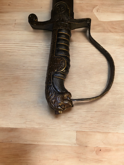 Title: WWII German Cavalry Sword with Brass Lion Head Handle by Carl Eickhorn