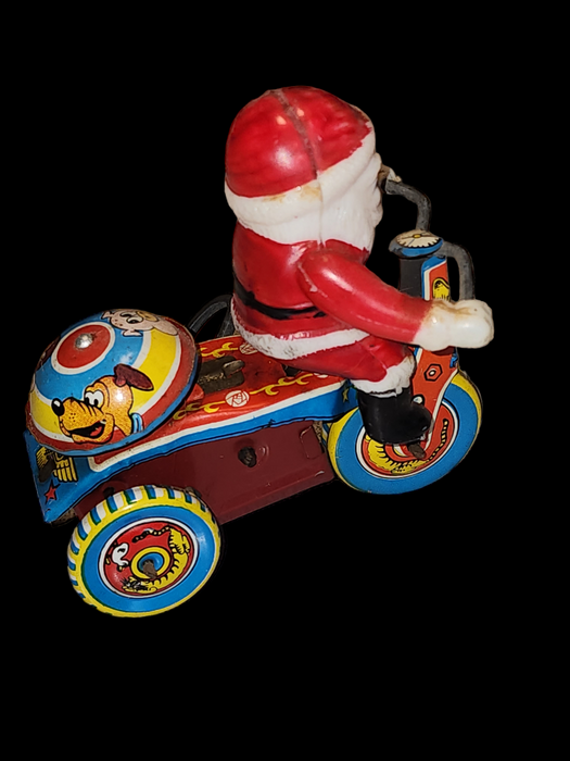 Celluloid santa riding bike Japan 1950/60s  winds and runs. Cartoon characters on bell and wheels
