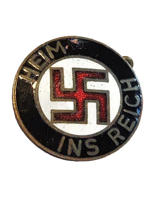 Title: Black, White, and Red Enamel Pin with Swastika in Red Surrounded by White with Black Border, with "Ins Heim Reich" in German