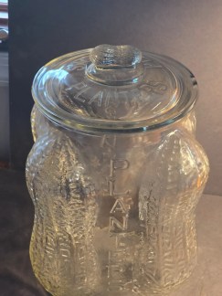 EMBOSSED PEANUTS ON BASE WITH PEANUT FINIAL. MRKD."MADE IN USA" ON BOTTOM. 13.5