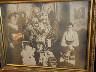 Early victorian christmas photo with tree 19x23 Framed as found under glass