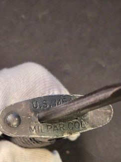 A genuine Milpar Co. M7 bayonet and M8A1 scabbard. This collectible piece of military history is a perfect addition for any enthusiast or collector of Vietnam War-era militaria. A classic and authentic find.