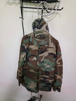 Full set of historic USMC Woodland Camouflage BDU uniform, jacket, and trousers laid out, formerly belonging to Lt. Gen. Robert F. Milligan.