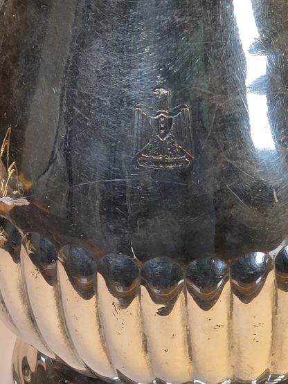 Christofle silver-plated creamer with the engraved Iraqi National Emblem (Eagle of Saladin) near the base, confirming its Palace provenance.