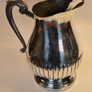 Silver Christofle water pitcher featuring the Iraqi Ba'ath Party Eagle of Saladin crest from the Saddam Hussein era