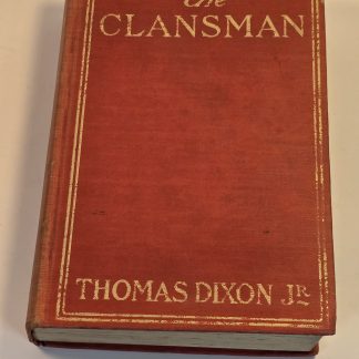 Antique red cloth hardcover book titled The Clansman by Thomas Dixon Jr with gold lettering