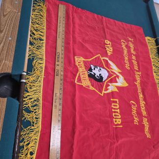 A ceremonial Russian Scout flag featuring a gold Fleur-de-lis and Russian Cyrillic text on a traditional tri-color background.