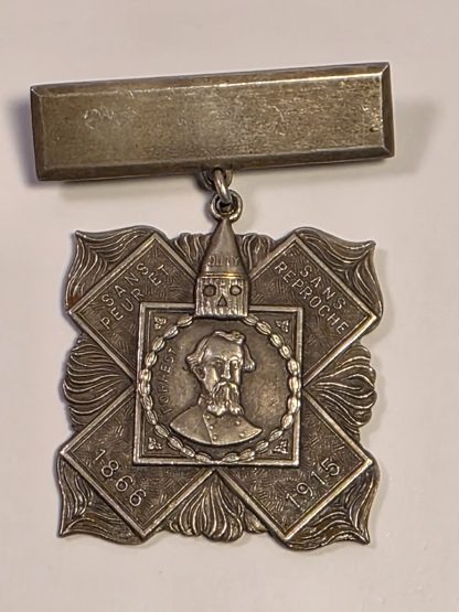 Reverse side of KKK Hero Cross medal with Whitehead & Hoag maker's mark and William Joseph Simmons Imperial Wizard inscription.